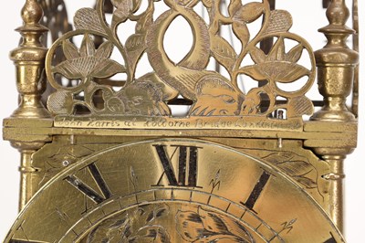 Lot JOHN HARRIS, LONDON. A CHARLES II BRASS STRIKING LANTERN CLOCK WITH BALANCE WHEEL VERGE ESCAPEMENT