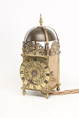 Lot JOHN HARRIS, LONDON. A CHARLES II BRASS STRIKING LANTERN CLOCK WITH BALANCE WHEEL VERGE ESCAPEMENT