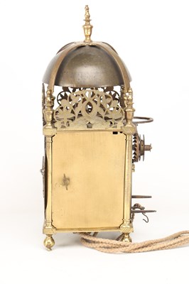 Lot JOHN HARRIS, LONDON. A CHARLES II BRASS STRIKING LANTERN CLOCK WITH BALANCE WHEEL VERGE ESCAPEMENT