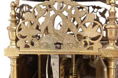 Lot JOHN HARRIS, LONDON. A CHARLES II BRASS STRIKING LANTERN CLOCK WITH BALANCE WHEEL VERGE ESCAPEMENT