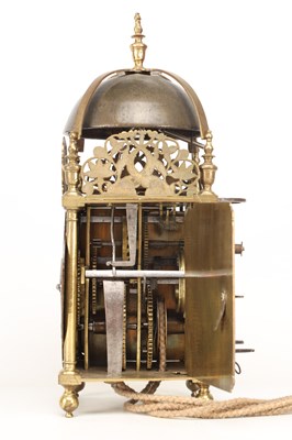 Lot JOHN HARRIS, LONDON. A CHARLES II BRASS STRIKING LANTERN CLOCK WITH BALANCE WHEEL VERGE ESCAPEMENT