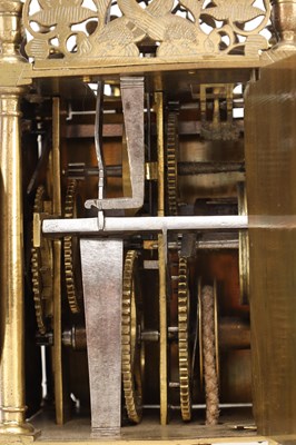 Lot JOHN HARRIS, LONDON. A CHARLES II BRASS STRIKING LANTERN CLOCK WITH BALANCE WHEEL VERGE ESCAPEMENT