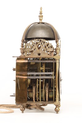 Lot JOHN HARRIS, LONDON. A CHARLES II BRASS STRIKING LANTERN CLOCK WITH BALANCE WHEEL VERGE ESCAPEMENT