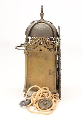Lot JOHN MONKHOUSE, LONDON. A GEORGE II BRASS VERGE STRIKING LANTERN CLOCK