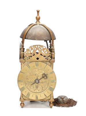 Lot HUMPHREY BANNISTER, CROYDON. A CHARLES II BRASS STRIKING LANTERN CLOCK