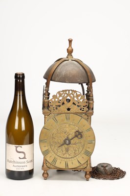 Lot HUMPHREY BANNISTER, CROYDON. A CHARLES II BRASS STRIKING LANTERN CLOCK