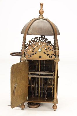 Lot HUMPHREY BANNISTER, CROYDON. A CHARLES II BRASS STRIKING LANTERN CLOCK