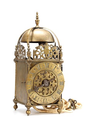 Lot A MID 17TH CENTURY BRASS STRIKING LANTERN CLOCK