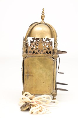 Lot A MID 17TH CENTURY BRASS STRIKING LANTERN CLOCK