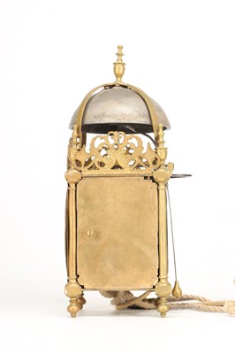 Lot THOMAS KNIGHT, LONDON. A 17TH CENTURY BRASS VERGE STRIKING LANTERN CLOCK WITH ALARM