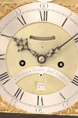 Lot THOMAS HUNTER JR., LONDON. A GEORGE III ORMOLU MOUNTED EBONISED VERGE STRIKING BRACKET CLOCK