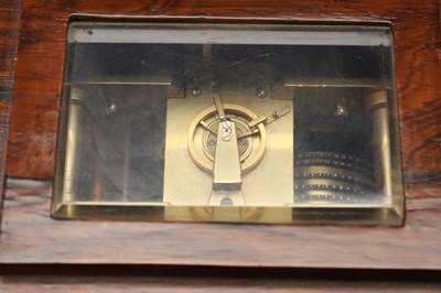 Lot JOHN MOORE & SONS, LONDON. A LATE REGENCY ROSEWOOD FOUR-GLASS FUSEE LIBRARY CLOCK