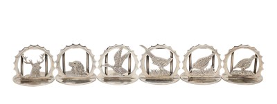Lot A SET OF SIX LATE 20TH CENTURY ENGLISH SILVER GAME PLACE CARD HOLDERS