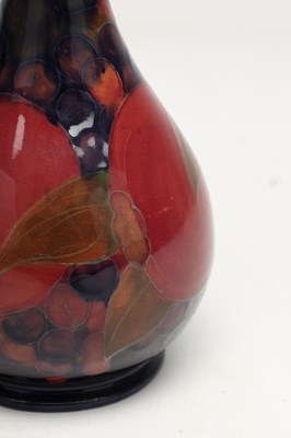 Lot AN EARLY 20TH CENTURY MOORCROFT POMEGRANATE PATTERN VASE