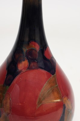 Lot AN EARLY 20TH CENTURY MOORCROFT POMEGRANATE PATTERN VASE
