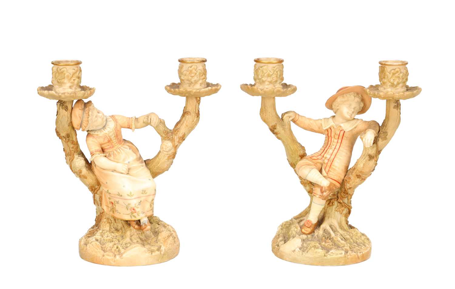 Lot A PAIR OF 20TH CENTURY ROYAL WORCESTER HADLEY PORCELAIN FIGURAL CANDLESTICKS