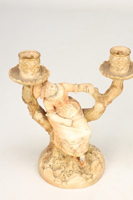 Lot A PAIR OF 20TH CENTURY ROYAL WORCESTER HADLEY PORCELAIN FIGURAL CANDLESTICKS