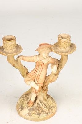 Lot A PAIR OF 20TH CENTURY ROYAL WORCESTER HADLEY PORCELAIN FIGURAL CANDLESTICKS