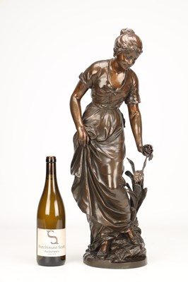 Lot SYLVAIN KINSBURGER (FRENCH 1855-1935) A PATINATED BRONZE FIGURE OF A YOUNG WOMAN WITH A FLOWER