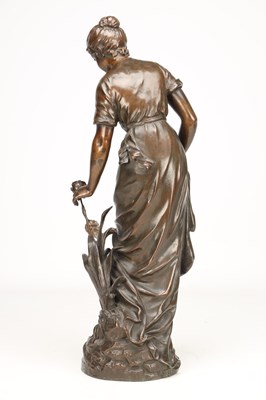 Lot SYLVAIN KINSBURGER (FRENCH 1855-1935) A PATINATED BRONZE FIGURE OF A YOUNG WOMAN WITH A FLOWER