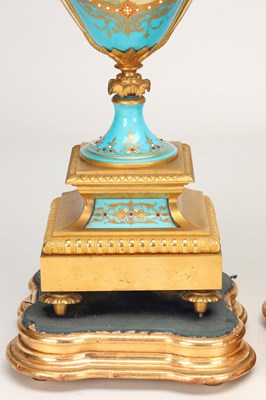 Lot 155 - A LARGE LATE 19TH CENTURY FRENCH SEVRES JEWELLED PORCELAIN AND ORMOLU TURQUOISE-GROUND CLOCK GARNITURE