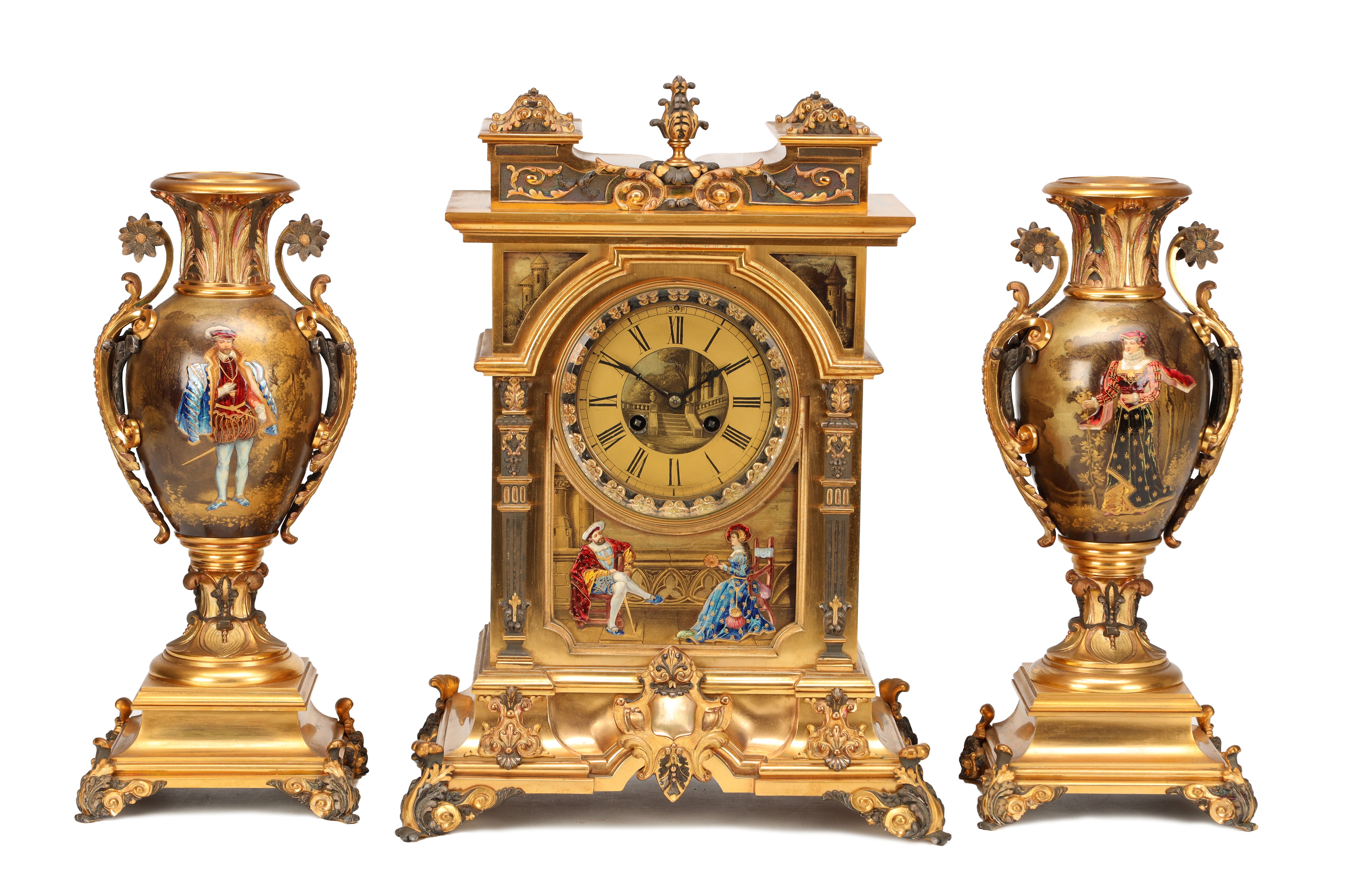 Gilt mantel clock flanked by a pair of decorative vases