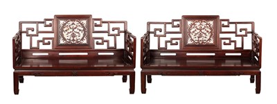 Lot A PAIR OF 19TH CENTURY CHINESE HARDWOOD MOTHER OF PEARL INLAID SETTEES