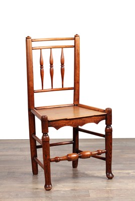 Lot A LATE 18TH CENTURY ELM SPINDLE BACK CHAIR