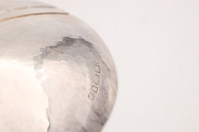 Lot A CONTEMPORARY ENGLISH SILVER TEXTURED DISH BY PHIL JORDAN