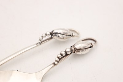 Lot TWO EARLY 20TH CENTURY GEORG JENSEN SILVER SPOONS MAGNOLIA PATTERN