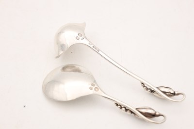 Lot TWO EARLY 20TH CENTURY GEORG JENSEN SILVER SPOONS MAGNOLIA PATTERN