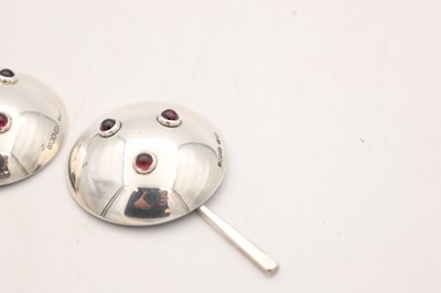 Lot ANGUS MCFADYEN A PAIR OF SCOTTISH SILVER, ENAMEL AND GARNET SALTS