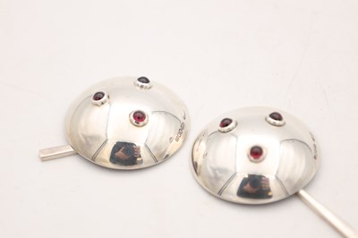Lot ANGUS MCFADYEN A PAIR OF SCOTTISH SILVER, ENAMEL AND GARNET SALTS