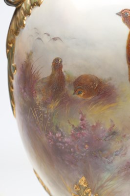 Lot AN EDWARDIAN ROYAL CHINA WORKS WORCESTER PORCELAIN TWO-HANDLED PEDESTAL VASE AND COVER