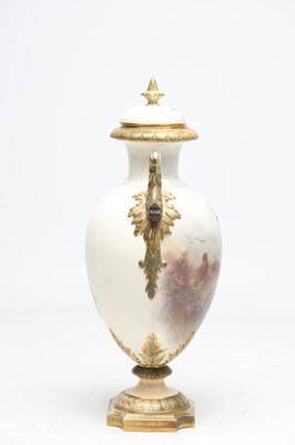 Lot AN EDWARDIAN ROYAL CHINA WORKS WORCESTER PORCELAIN TWO-HANDLED PEDESTAL VASE AND COVER