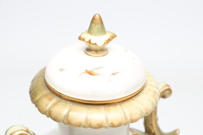 Lot AN EDWARDIAN ROYAL CHINA WORKS WORCESTER PORCELAIN TWO-HANDLED PEDESTAL VASE AND COVER