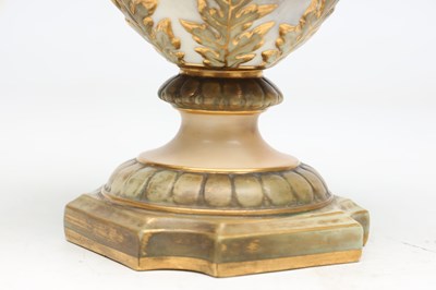 Lot AN EDWARDIAN ROYAL CHINA WORKS WORCESTER PORCELAIN TWO-HANDLED PEDESTAL VASE AND COVER