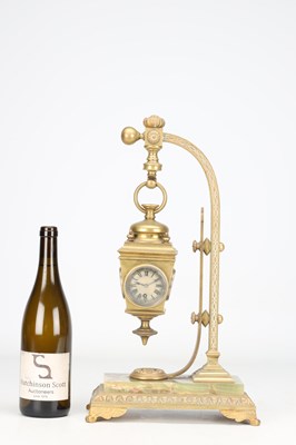 Lot 5 - AN UNUSUAL LATE 19TH CENTURY FRENCH BRASS AND ONYX NOVELTY MANTEL CLOCK