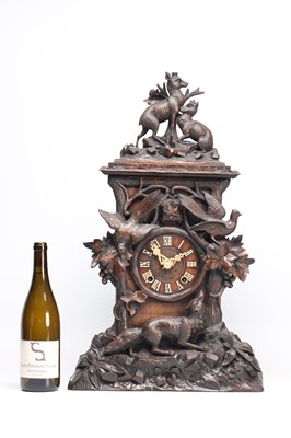 Lot 117 - A 19TH CENTURY BLACK FOREST CARVED WALNUT DOUBLE FUSEE CUCKOO CLOCK