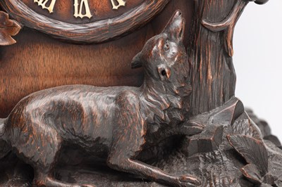 Lot 117 - A 19TH CENTURY BLACK FOREST CARVED WALNUT DOUBLE FUSEE CUCKOO CLOCK