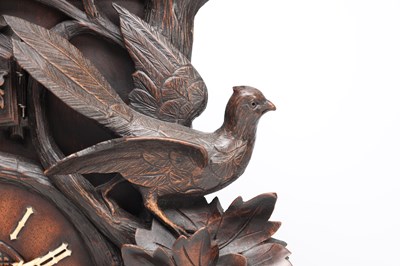 Lot 117 - A 19TH CENTURY BLACK FOREST CARVED WALNUT DOUBLE FUSEE CUCKOO CLOCK