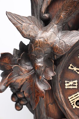 Lot 117 - A 19TH CENTURY BLACK FOREST CARVED WALNUT DOUBLE FUSEE CUCKOO CLOCK