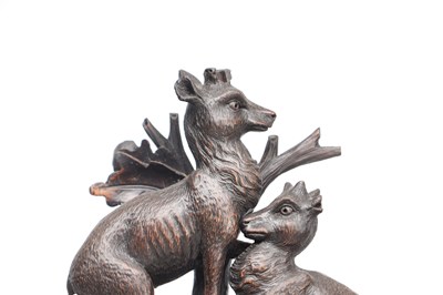 Lot 117 - A 19TH CENTURY BLACK FOREST CARVED WALNUT DOUBLE FUSEE CUCKOO CLOCK