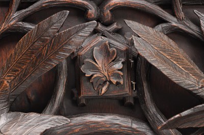 Lot 117 - A 19TH CENTURY BLACK FOREST CARVED WALNUT DOUBLE FUSEE CUCKOO CLOCK