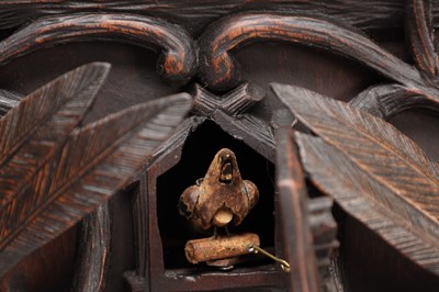 Lot 117 - A 19TH CENTURY BLACK FOREST CARVED WALNUT DOUBLE FUSEE CUCKOO CLOCK