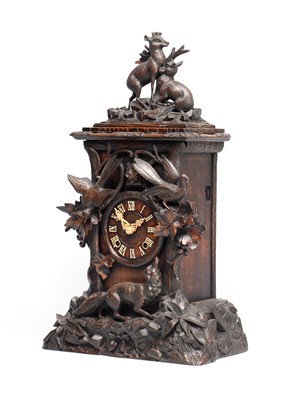 Lot 117 - A 19TH CENTURY BLACK FOREST CARVED WALNUT DOUBLE FUSEE CUCKOO CLOCK