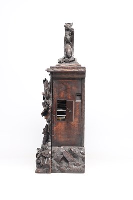 Lot 117 - A 19TH CENTURY BLACK FOREST CARVED WALNUT DOUBLE FUSEE CUCKOO CLOCK
