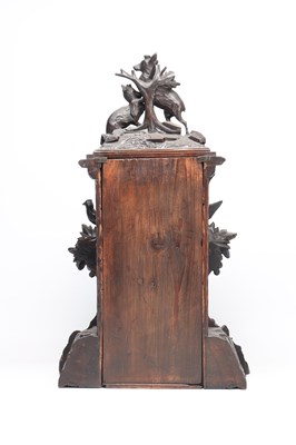 Lot 117 - A 19TH CENTURY BLACK FOREST CARVED WALNUT DOUBLE FUSEE CUCKOO CLOCK
