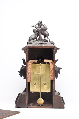 Lot 117 - A 19TH CENTURY BLACK FOREST CARVED WALNUT DOUBLE FUSEE CUCKOO CLOCK