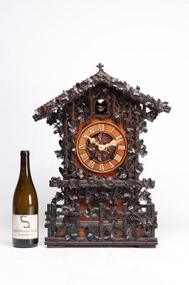Lot 95 - A GOOD 19TH CENTURY BLACK FOREST CARVED WALNUT DOUBLE FUSEE CUCKOO CLOCK